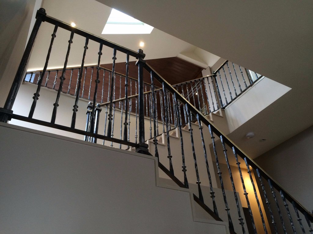 Staircase with brass handrail two