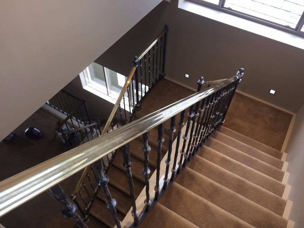 Staircase with brass handrails THREE