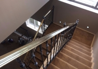 Staircase with brass handrails THREE